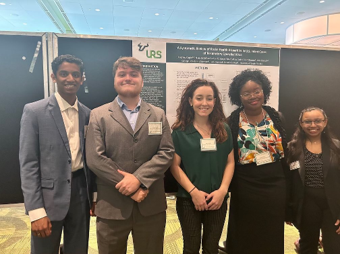 URS researchers presenting a poster - 2023